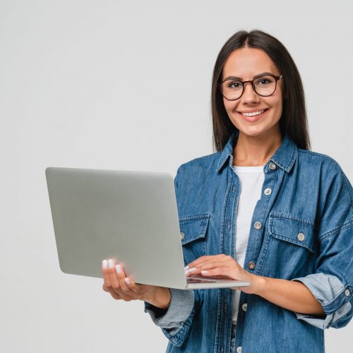 Young,Smiling,Caucasian,Student,Freelancer,Woman,Using,Laptop,For,Remote